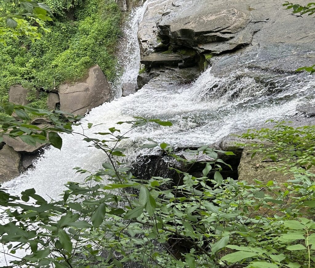 A portion of a waterfall is seen.