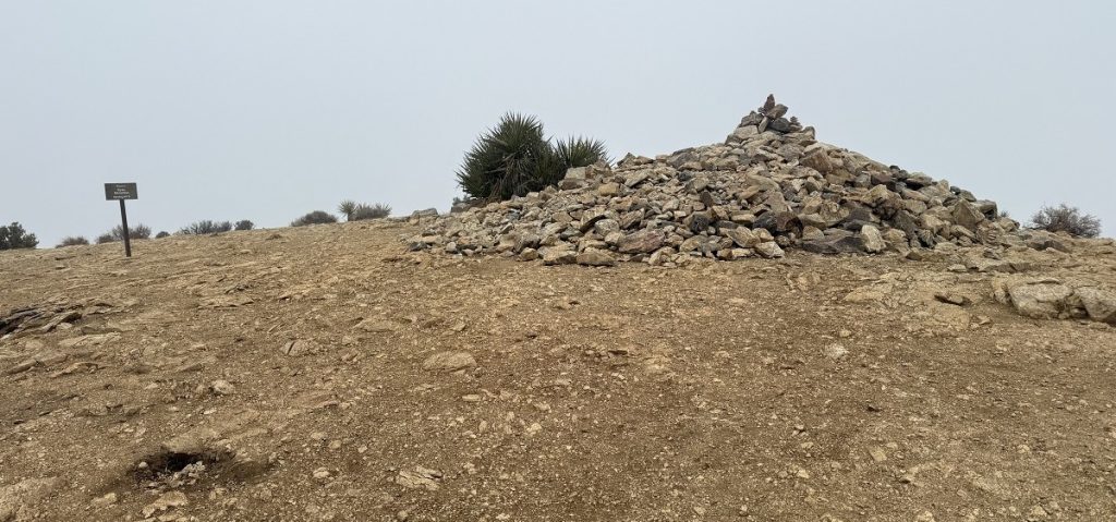 A mound of rocks marks the peak of a mountain.