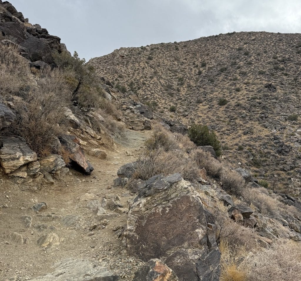 A dirt trail leads to more rocky areas.