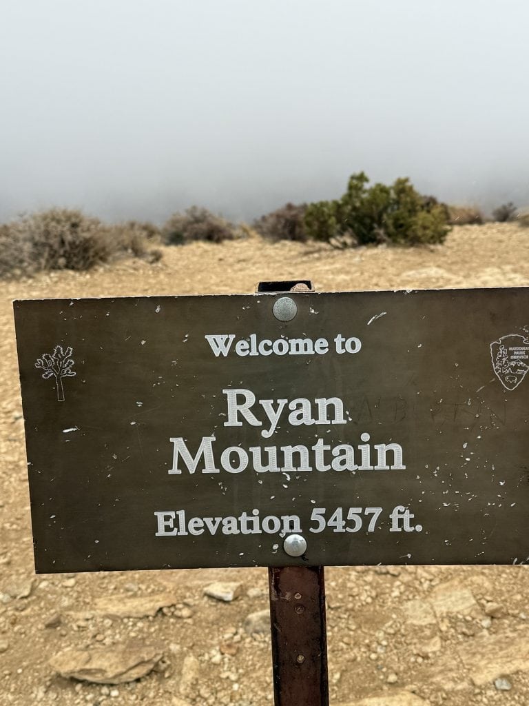A sign says "Welcome to Ryan Mountain."