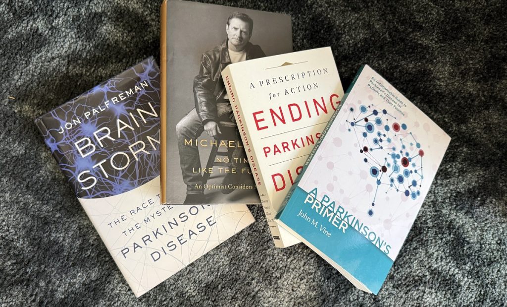 Four books are grouped on the floor about Parkinson's.