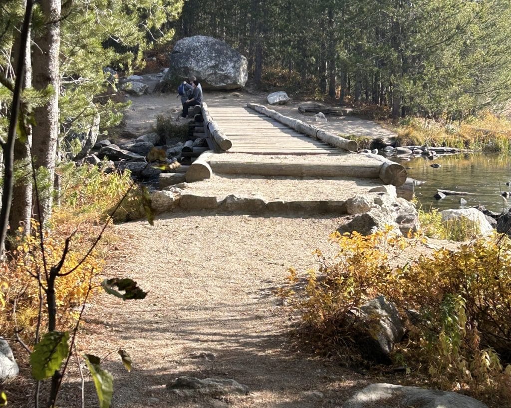 A bridge crosses a shallow waterway.