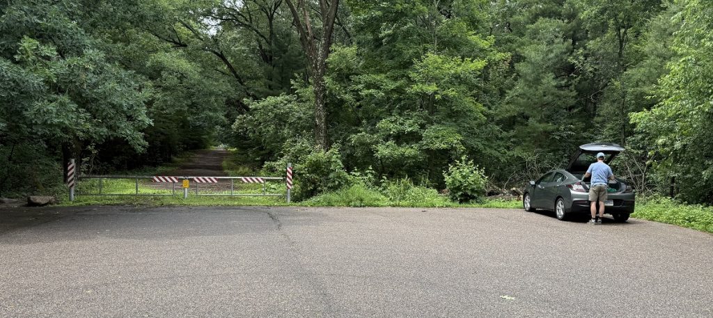 A car is parked in an otherwise empty lot.